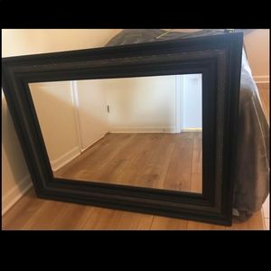 A large black decorative mirror